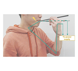 Chopstick-like device that provides weak electrical stimulation